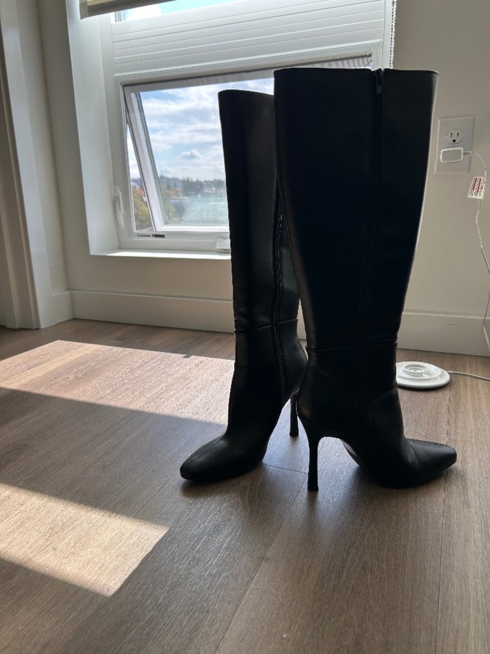 Tall black heeled boots